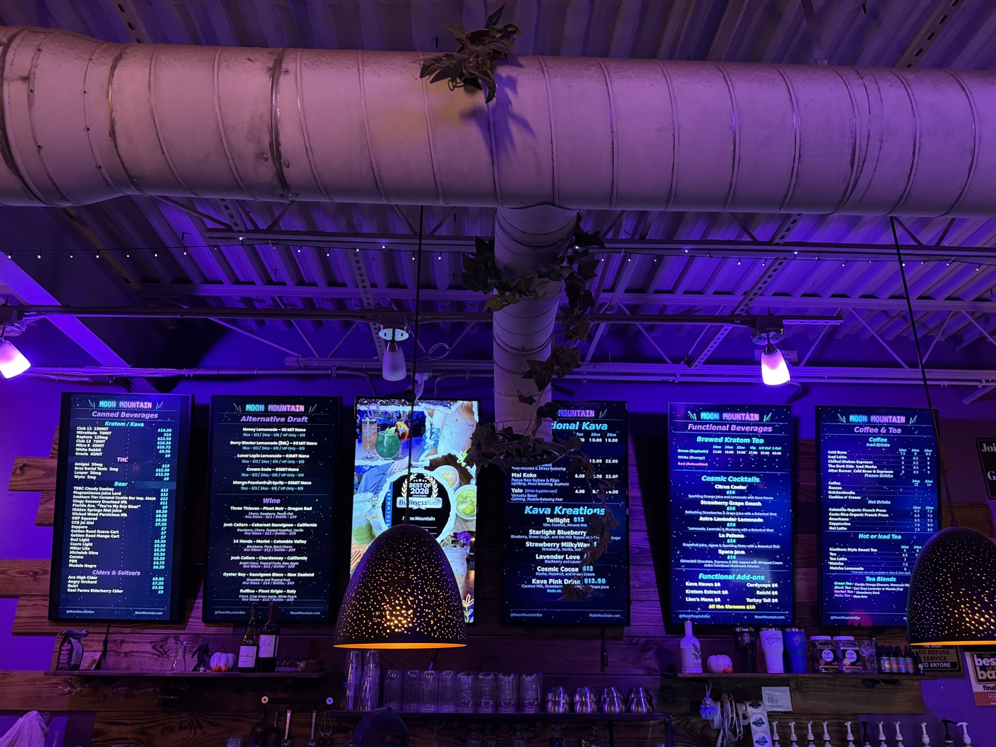 Kava, coffee, beer and wine menu boards above the bar at Moon Mountain in Brandon FL